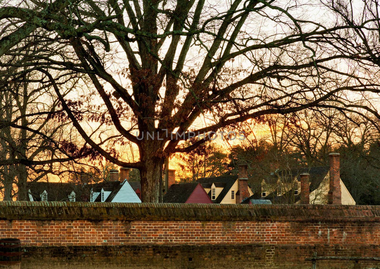 WILLIAMSBURG, VIRGINIA - DECEMBER 30: Sun rises over the restored houses on December 30, 2011. Colonial Williamsburg's 301 acres includes many restored buildings and houses