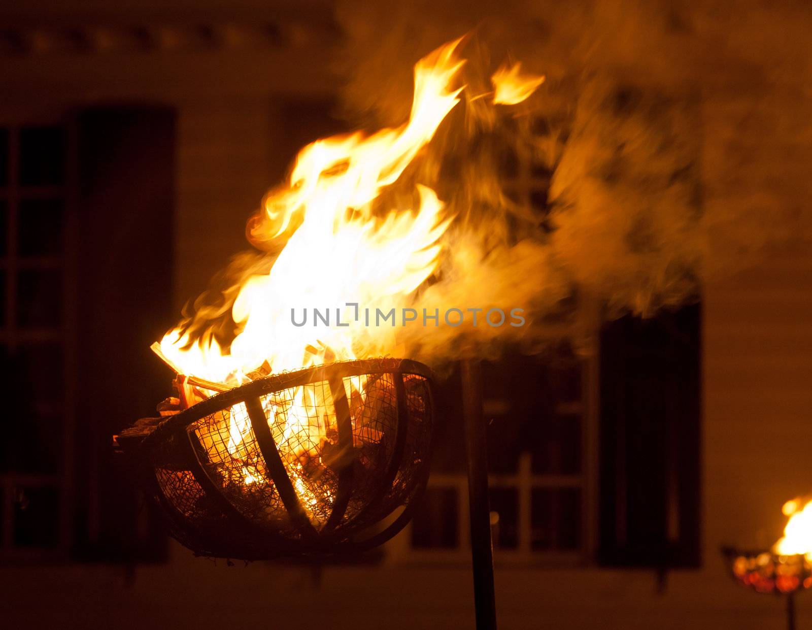 Fiery basket for kindling used to light a street at night