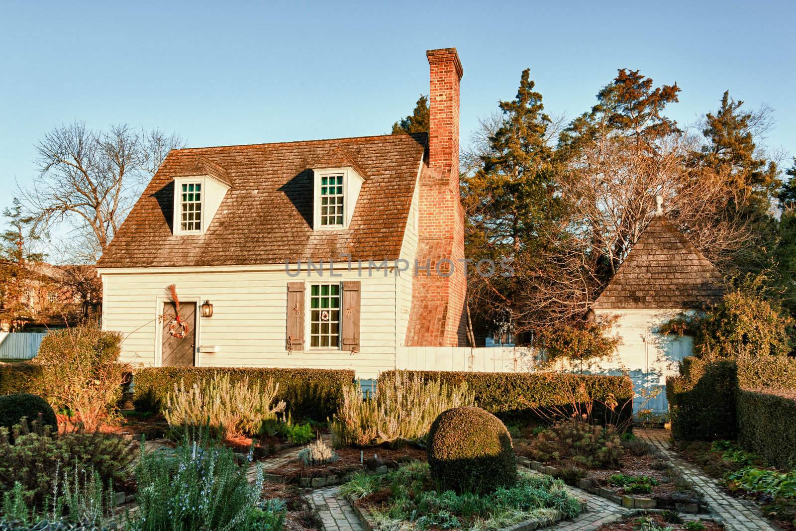 WILLIAMSBURG, VIRGINIA - DECEMBER 30: Sun rises on old house on December 30, 2011. Colonial Williamsburg's 301 acres includes many restored buildings and houses