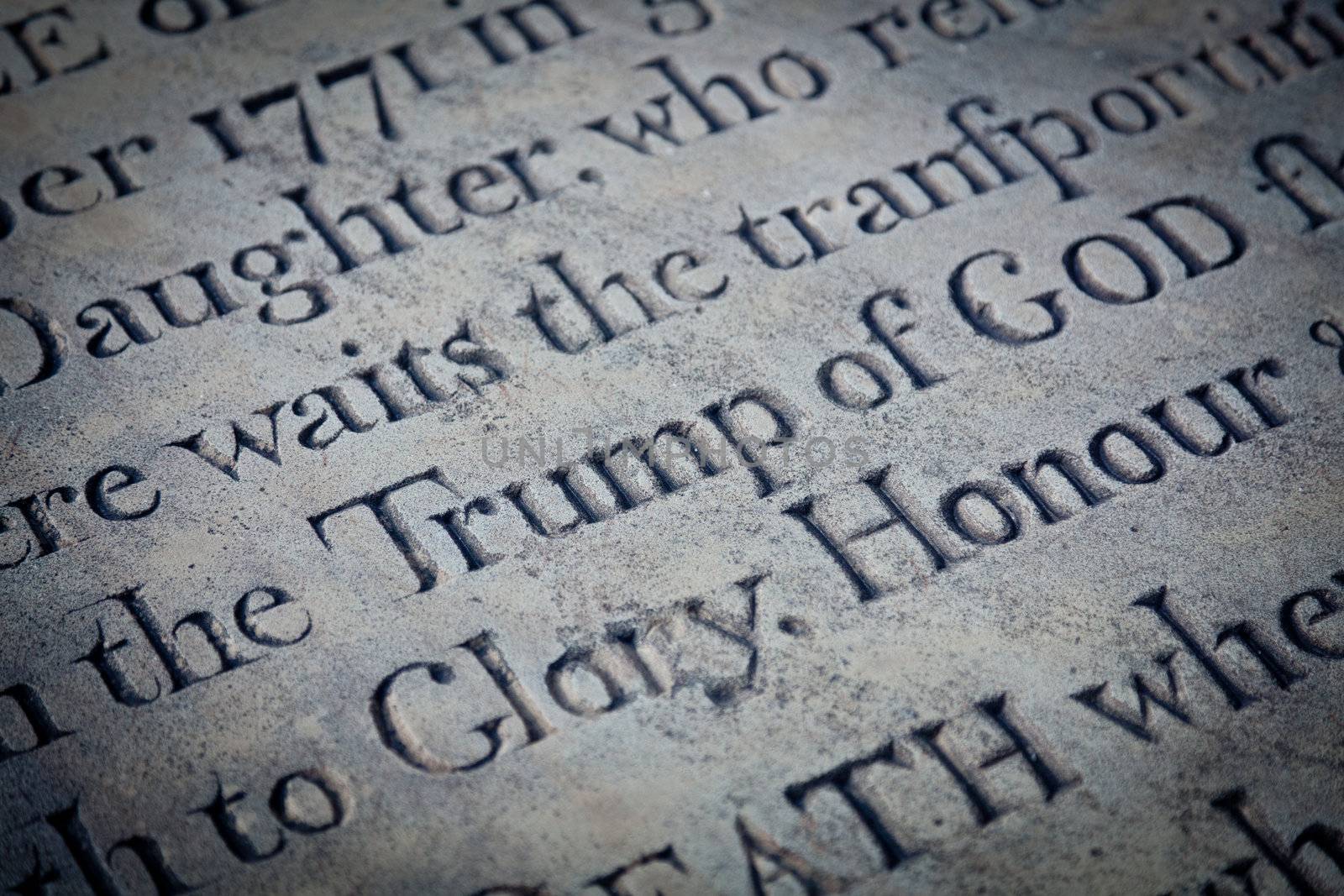 Potential humorous carving focused on Trump of god in churchyard gravestone