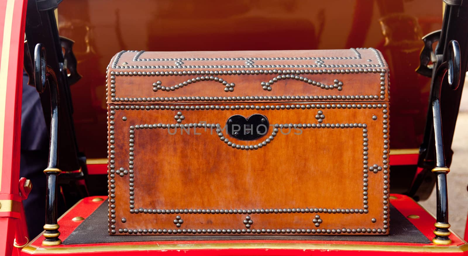 Leather studded luggage box on the rear of a horse coach