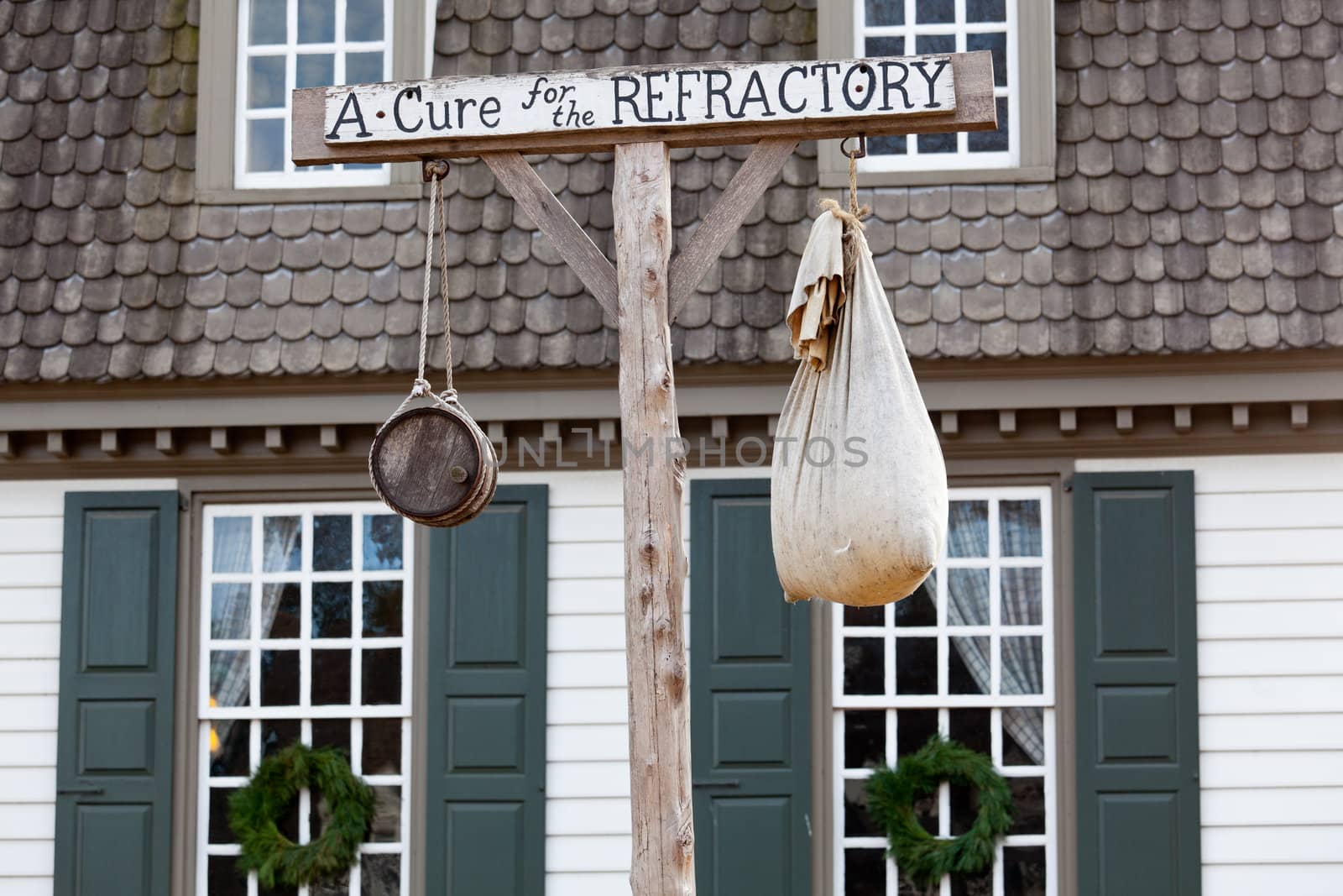 WILLIAMSBURG, VIRGINIA - DECEMBER 29: Antique sign outside tavern on December 29, 2011. Colonial Williamsburg's 301 acres includes many restored buildings and houses