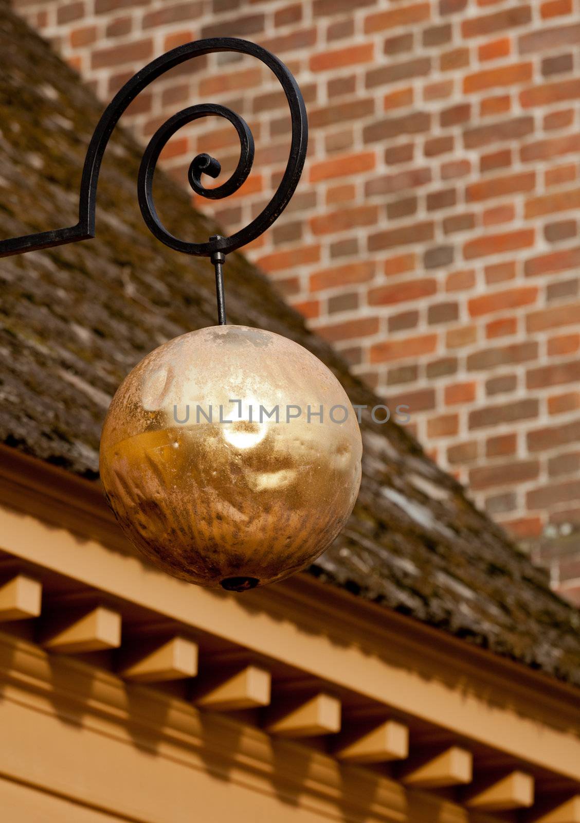 Golden sphere in front of old Jewellery shop