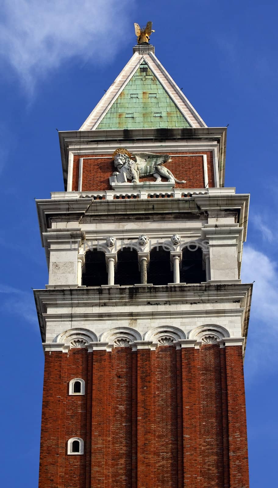 The Campanile Bell Tower Saint Mark's Winged Lion Venice Italy

Resubmit--In response to comments from reviewer have further procesed image to reduce noise, sharpen focus and adjust lighting.