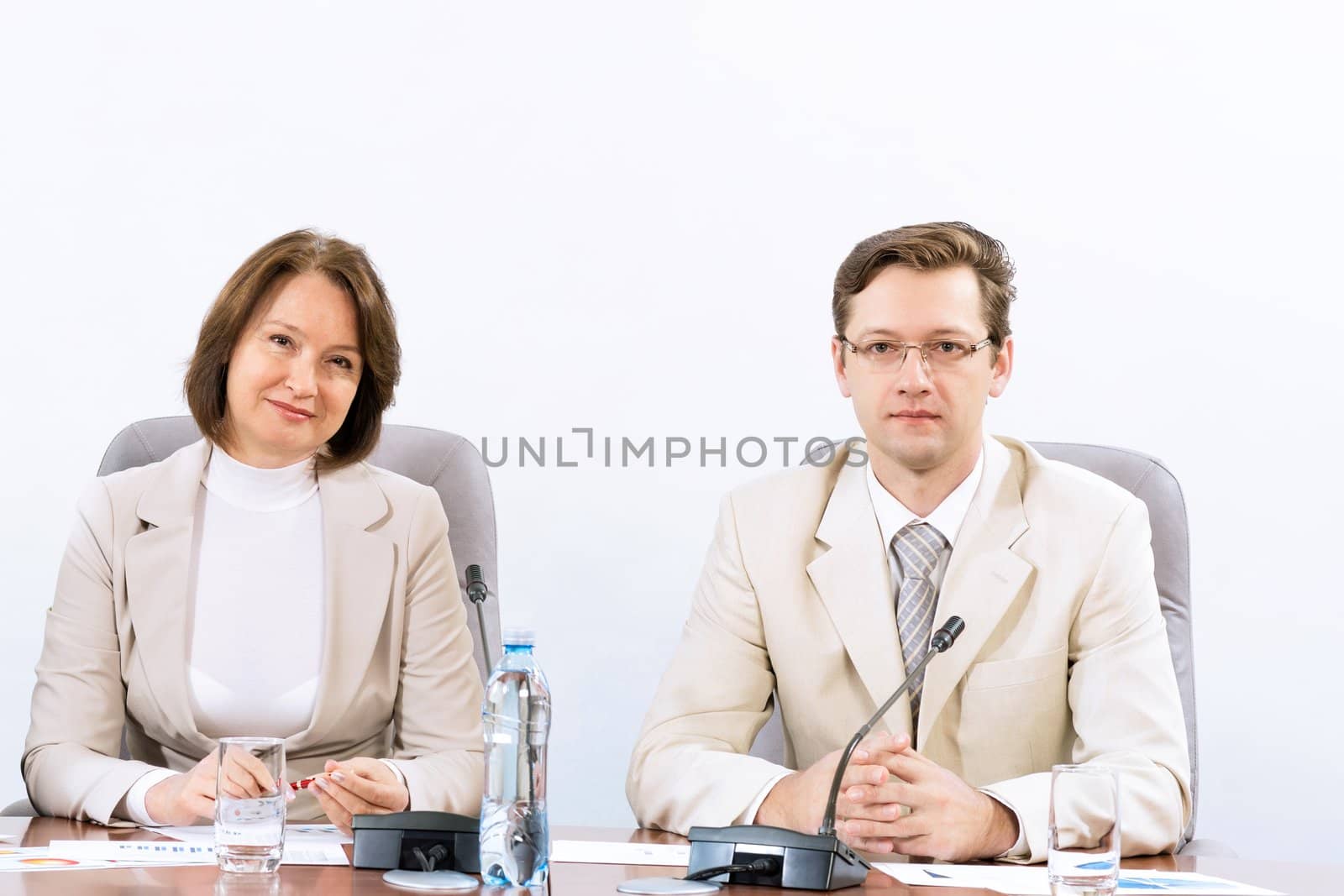 businessmen sitting in a chair at the table, communicate at the conference