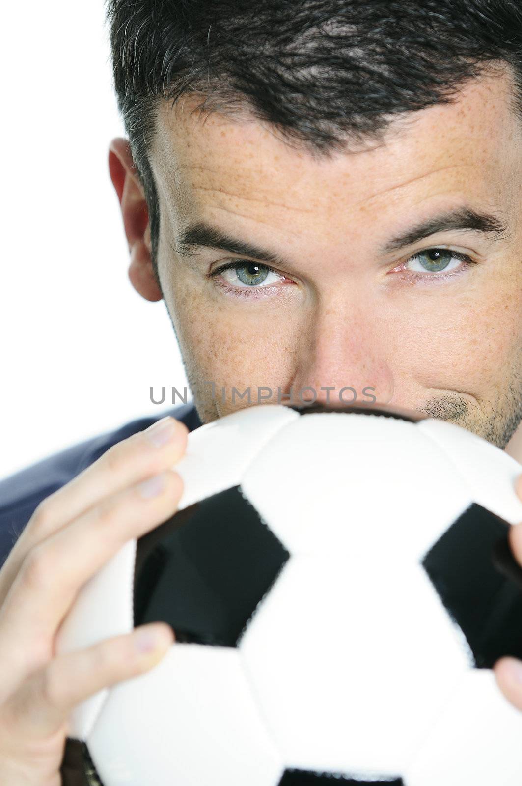 closeup of passionate soccer player with white and black balloon