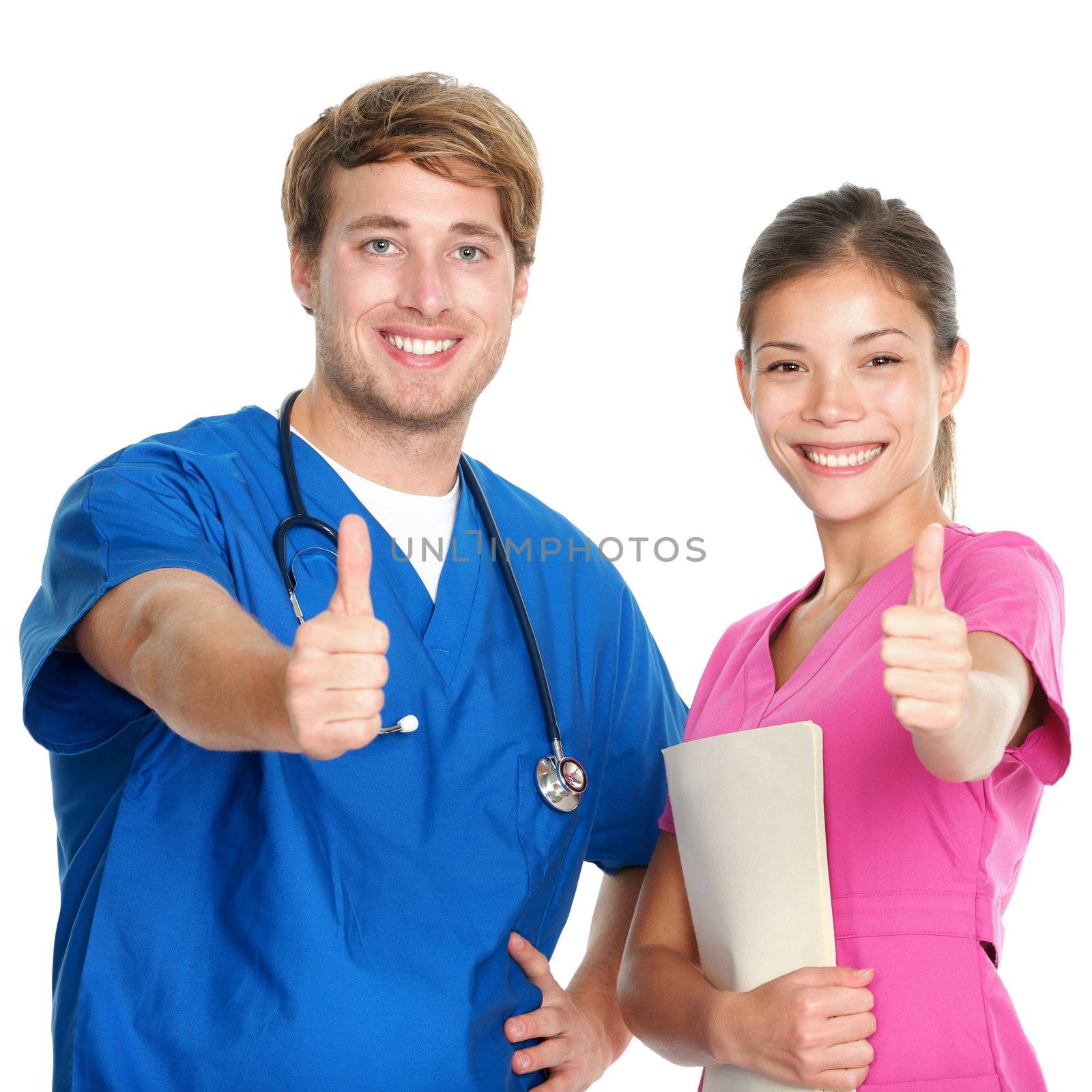 Nurse and doctor team giving happy thumbs up smiling joyful at camera. Young medical professionals isolated on white background. Asian woman and Caucasian man in their 20s.