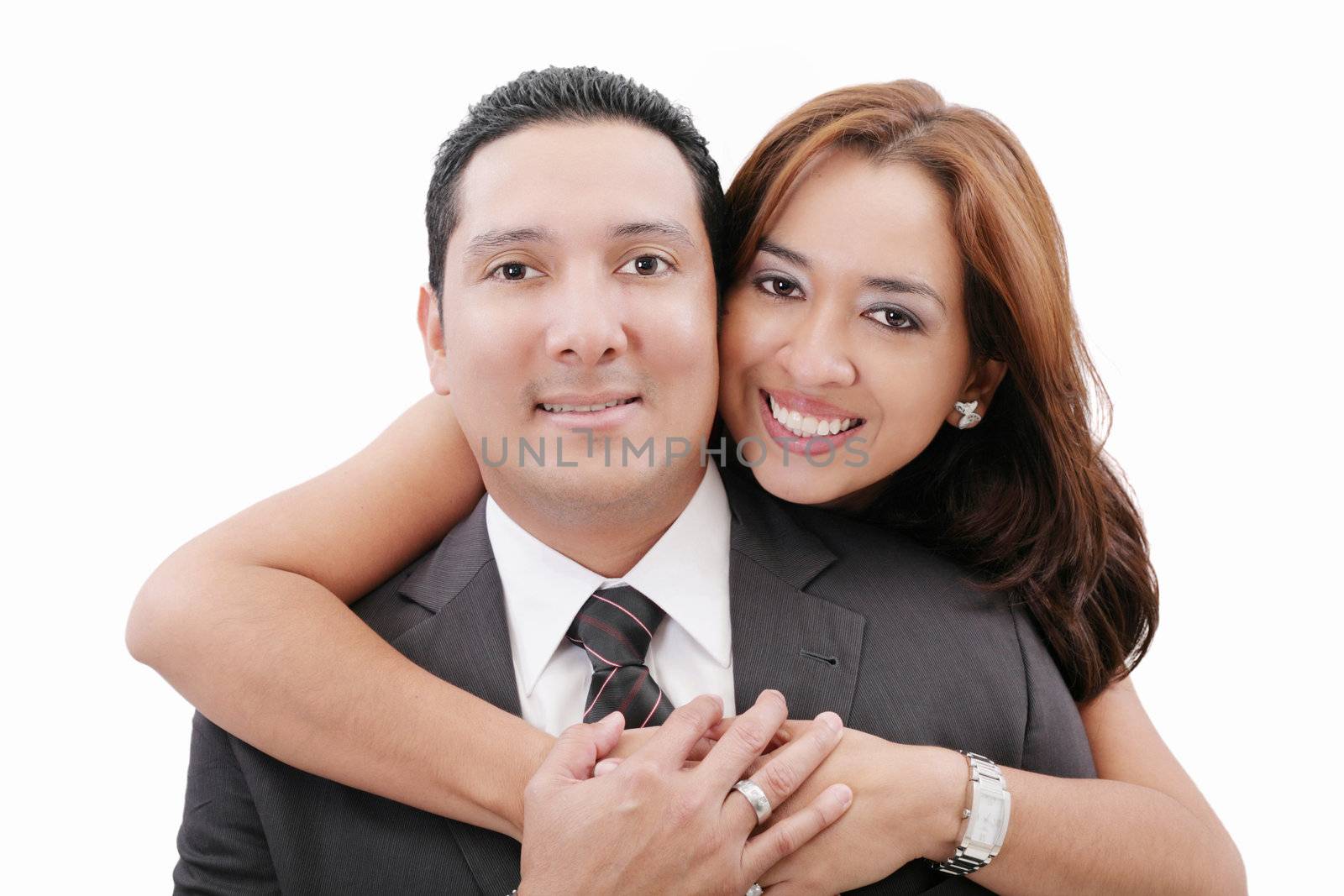 Portrait of loving couple hugging man from behind by dacasdo