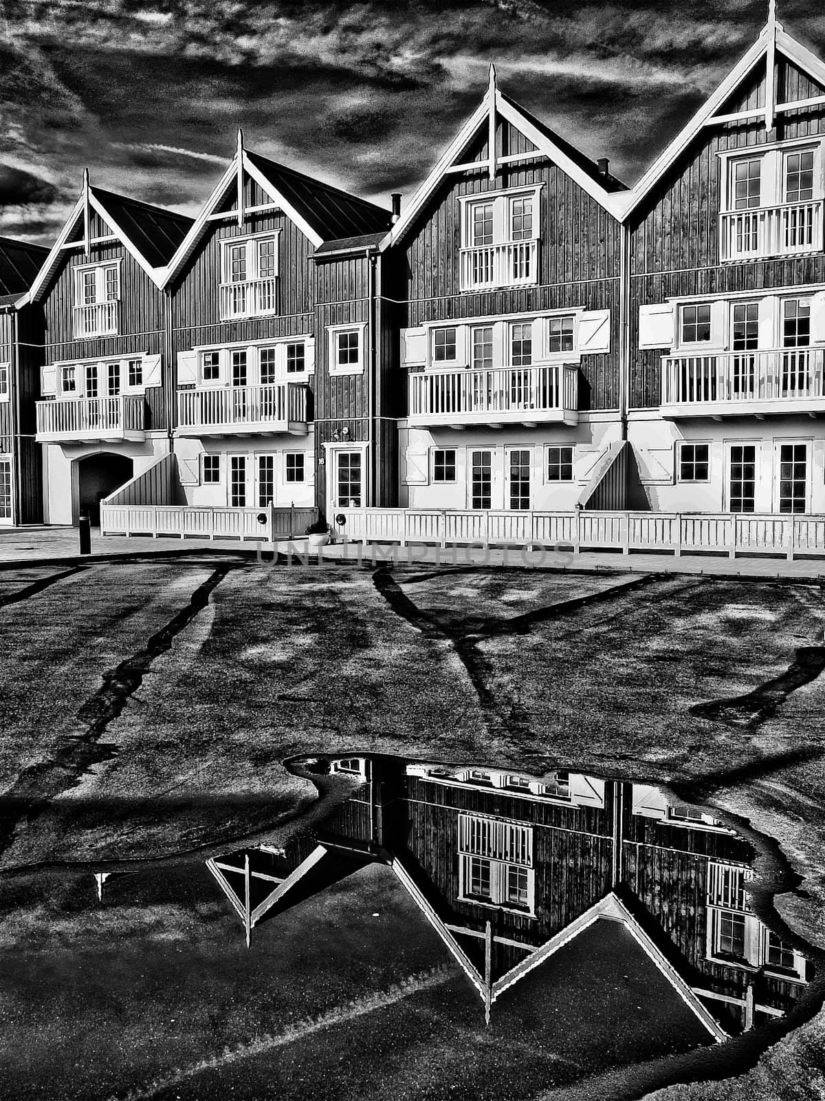 Modern classical design beach summer houses reflected perfectly in a small water pond digital art manipulation