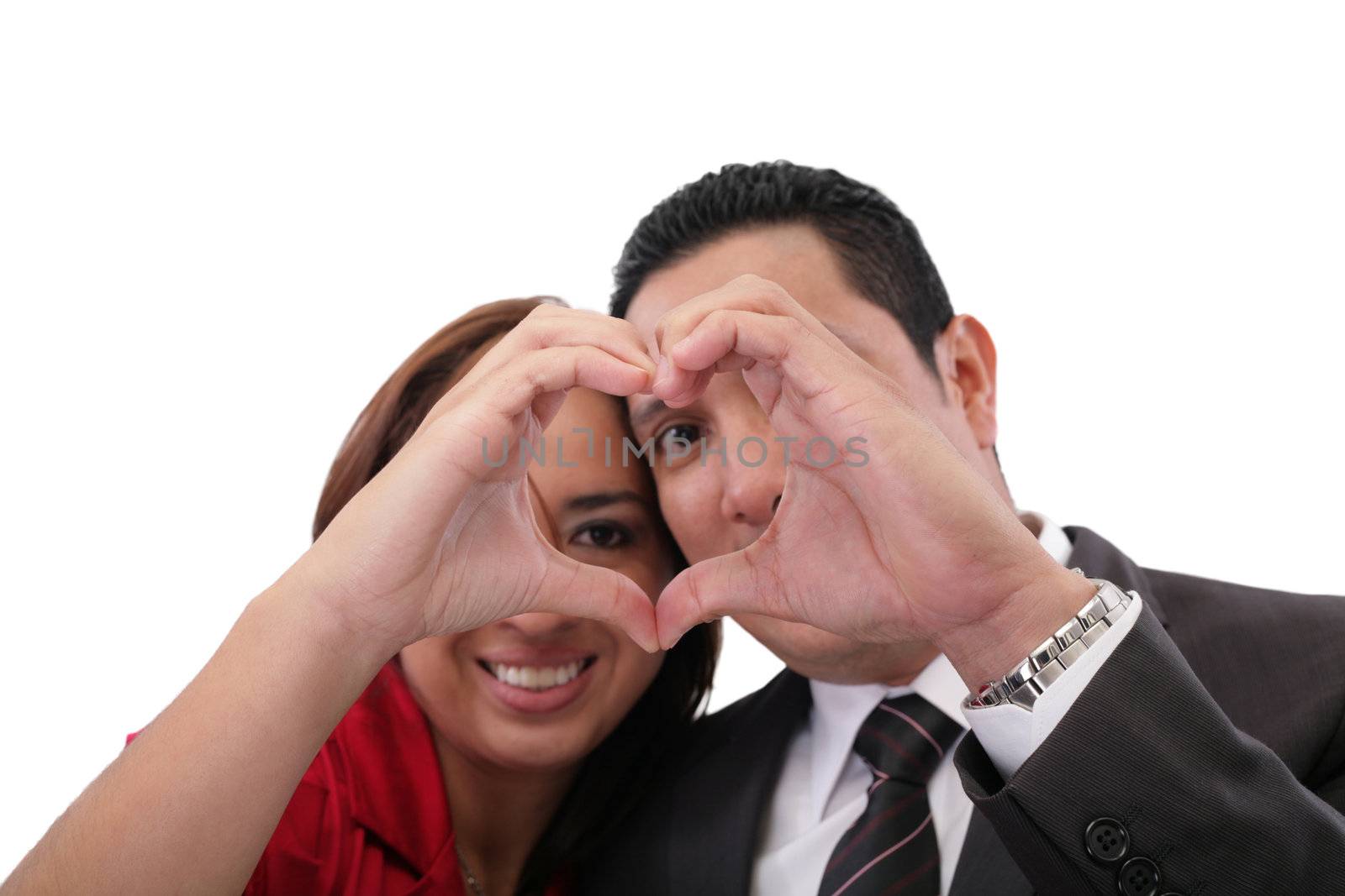 Happy couple in love showing heart with their fingers