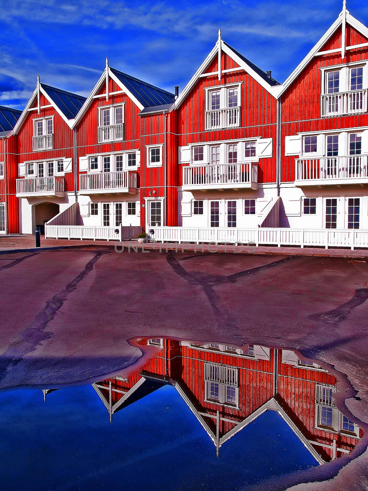Modern classical design beach summer houses reflected perfectly in a small water pond digital art manipulation