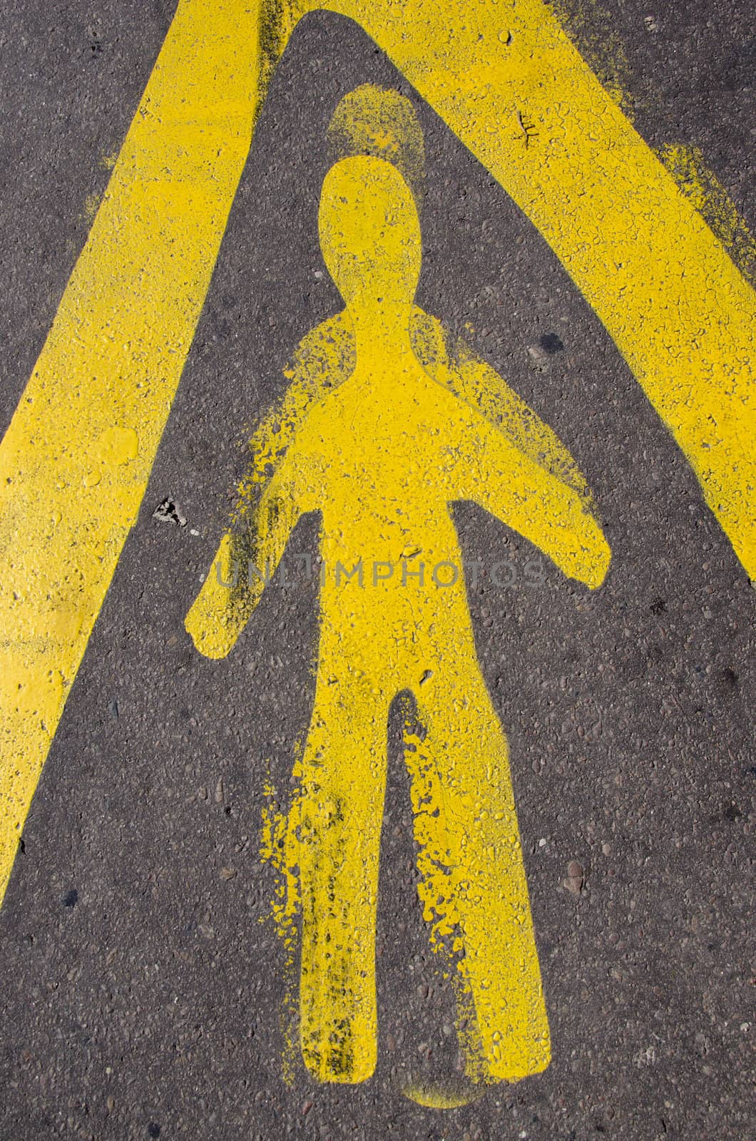 yellow road sign on urban asphalt background