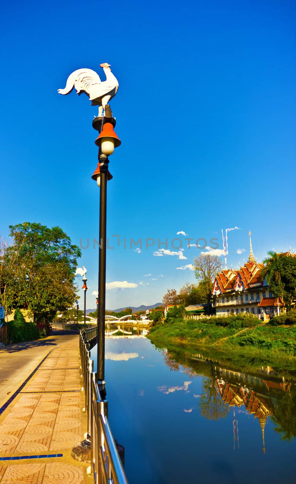 light pole on blue sky background by sutipp11