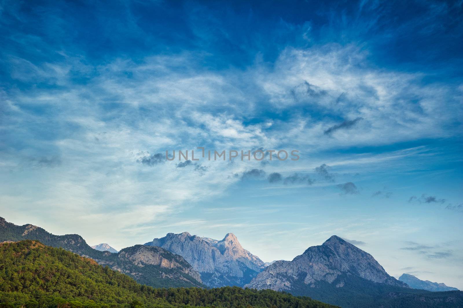 Dramatic lanscape of a sunset over the mountains and the sea