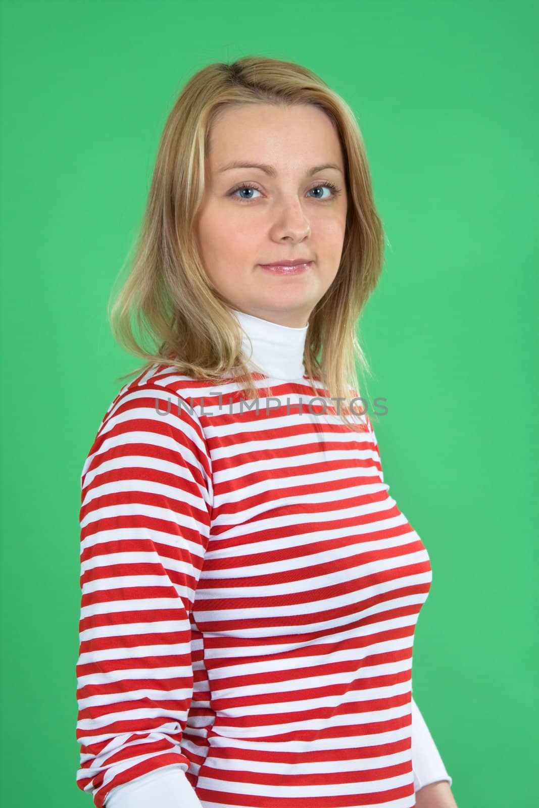 The woman the blonde in studio on a green background