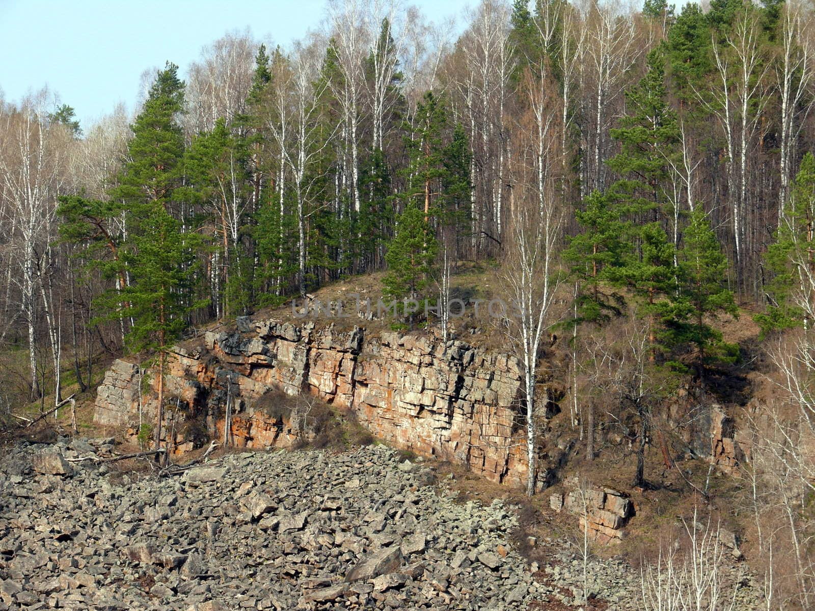 Rocks in Porogi Village, Satka, Chelyabinsk area, Russia. by Stoyanov