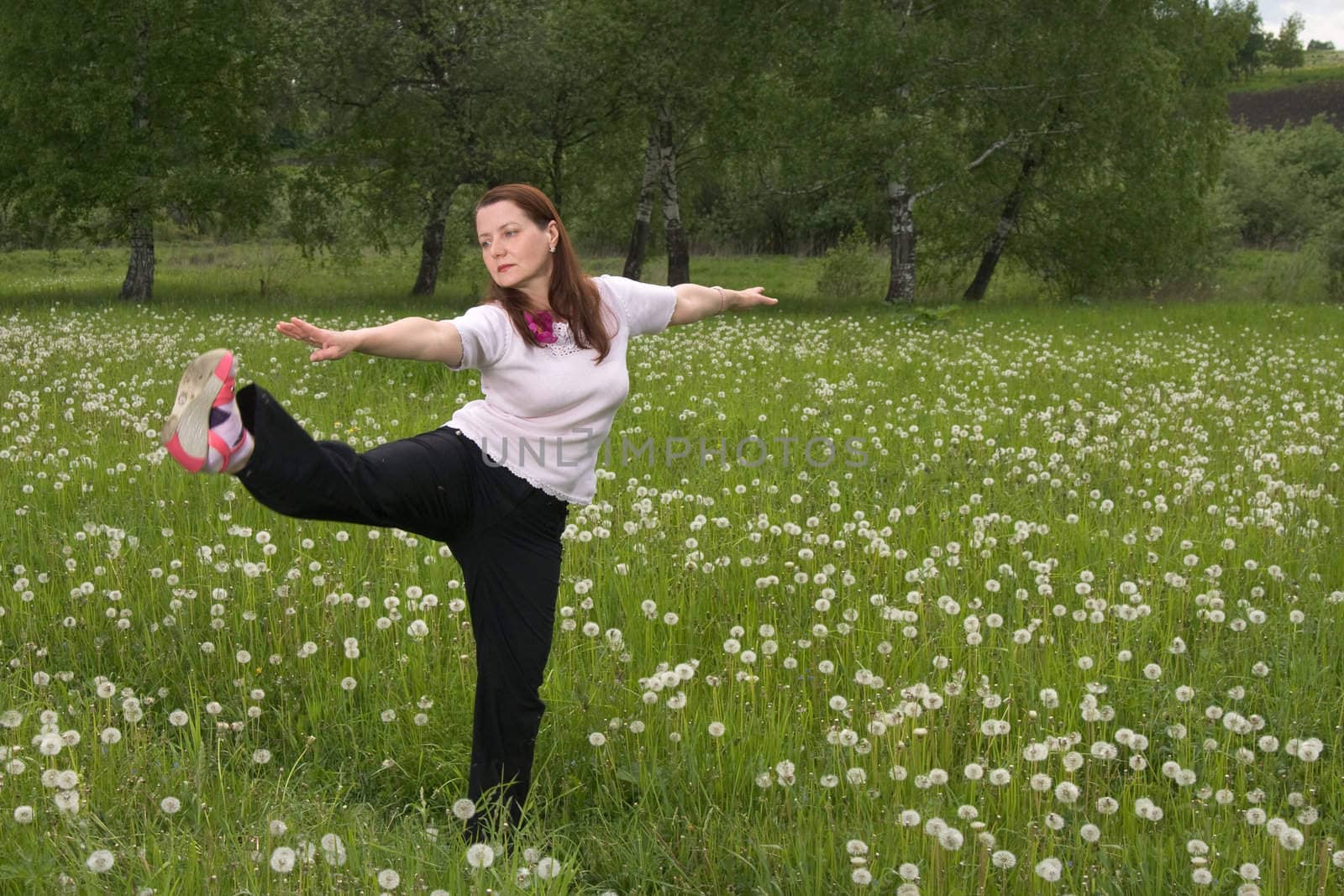 Women 50 years of gymnastics on the nature