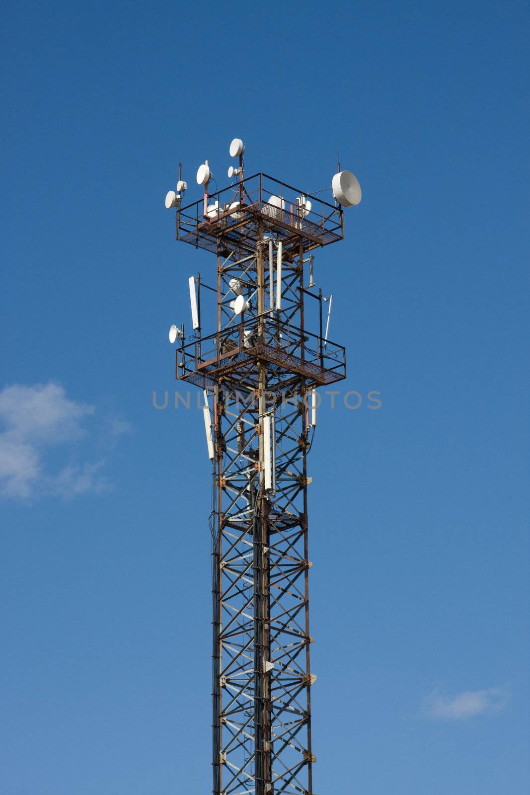 Aerials of the mobile communications on a background of the blue sky
