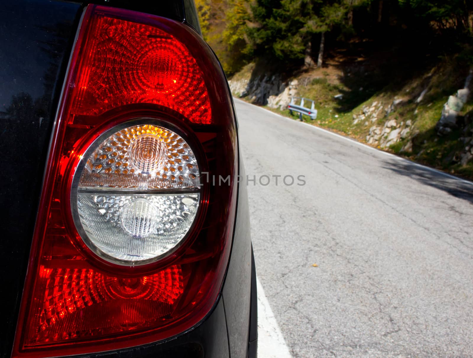 Rear car light with mountain background