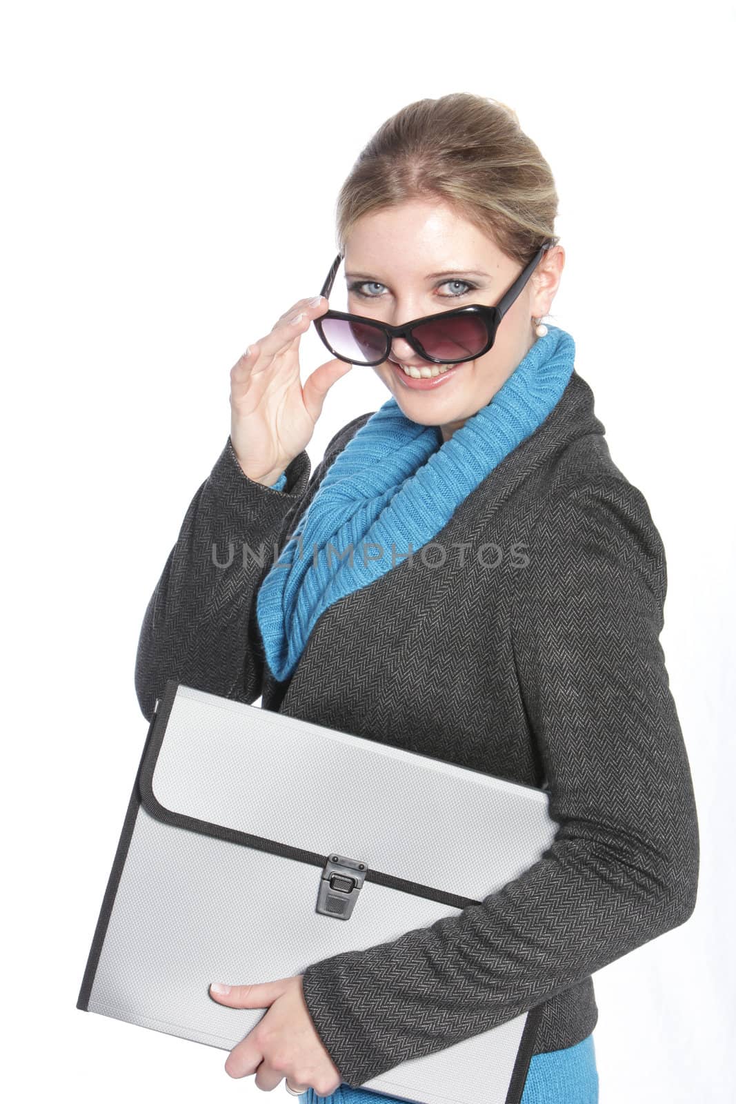 Smiling executive female holding a folder bag