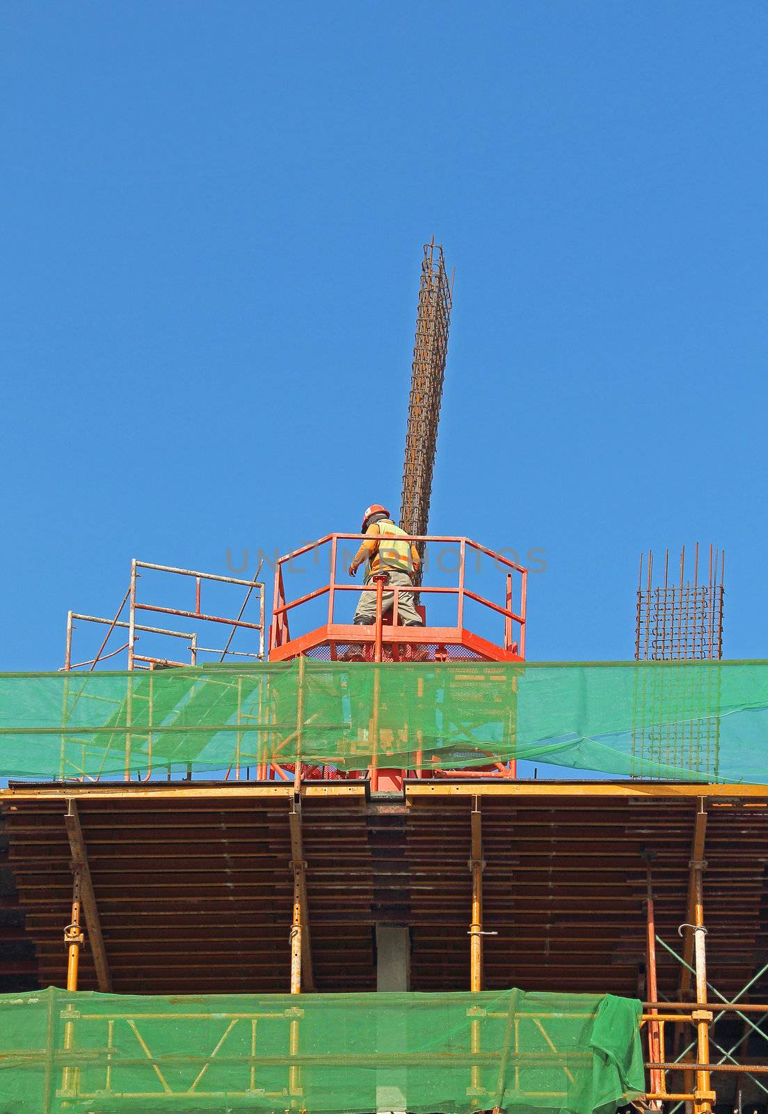 Building under construction with worker