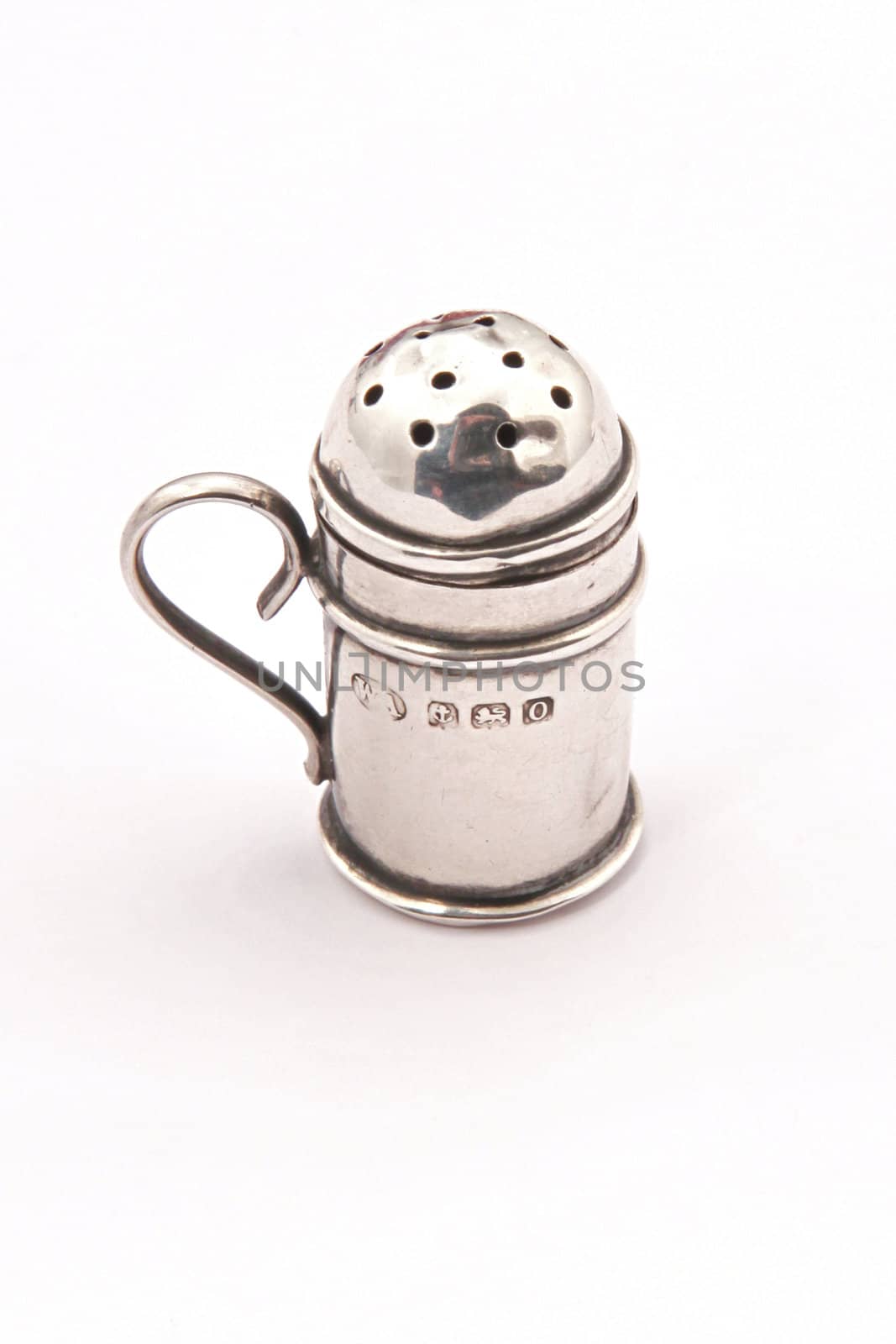 Hallmarked sterling silver pepper pot on a white background.