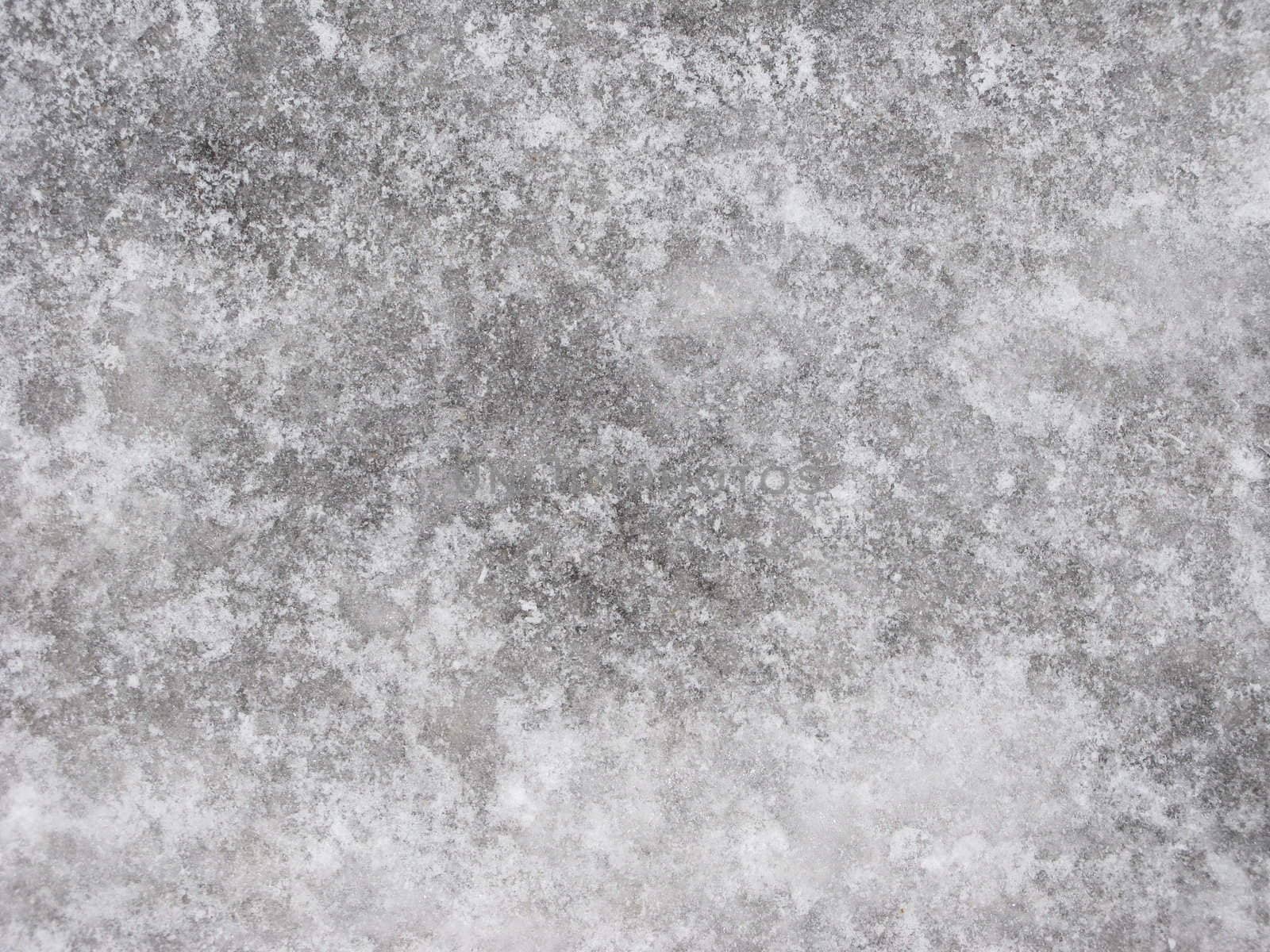 Ice-covered pavement surface texture, useful as background