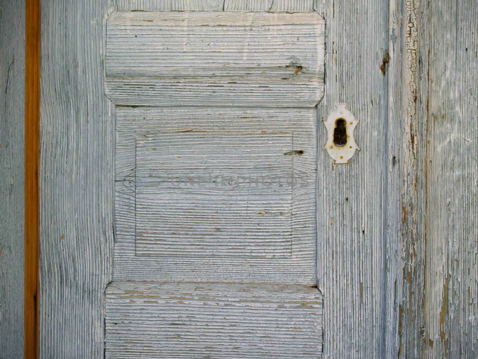 detail of an old weathered wooden door