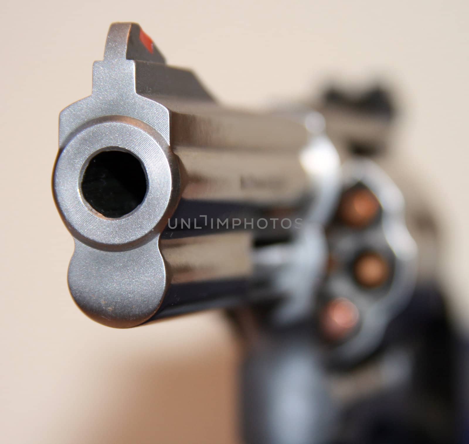 Threatening look down a Smith & Wesson .357 gun barrel. Gun is fully loaded with 7 rounds.