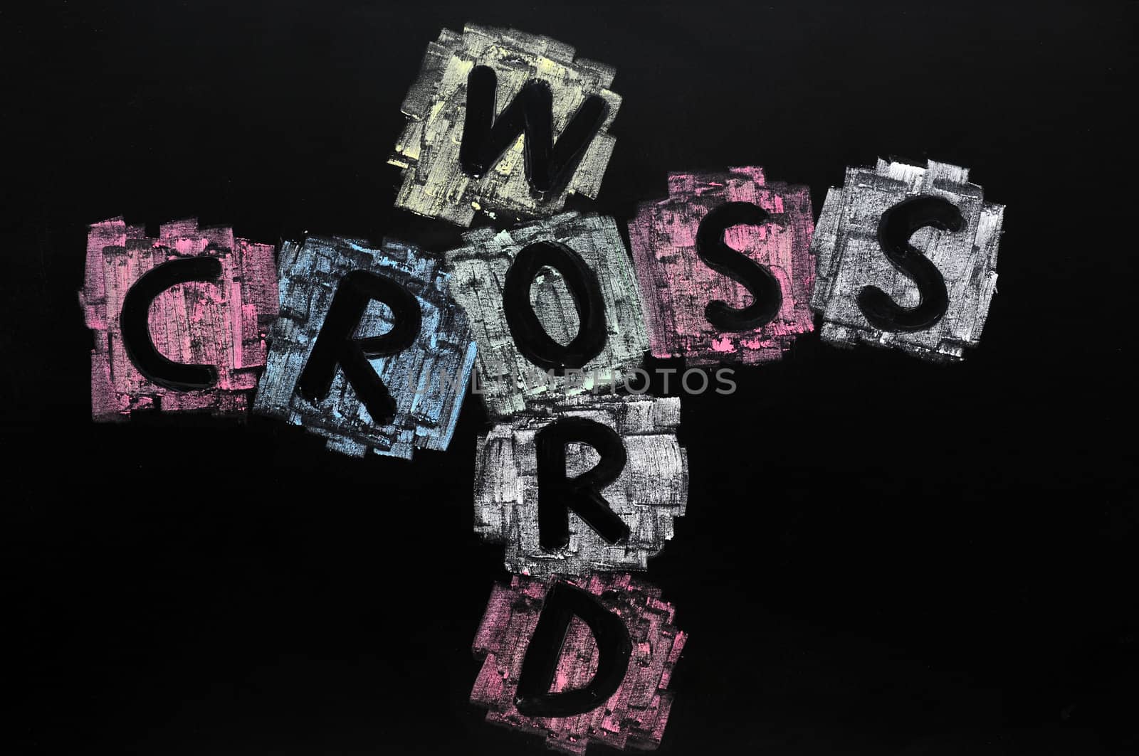 Crossword drawn with colorful chalk on a blackboard