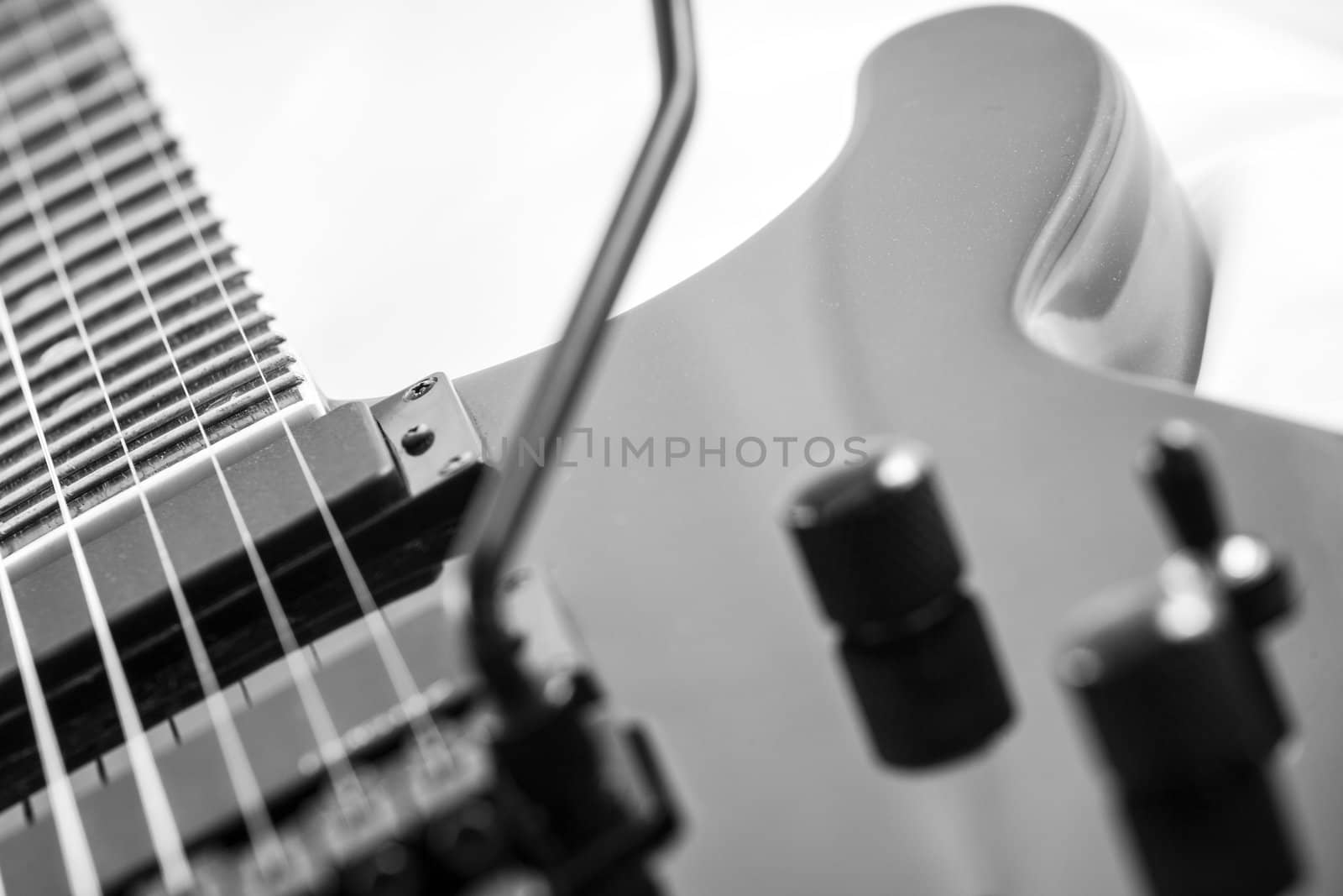 Electric guitar detail shots over white backdrop