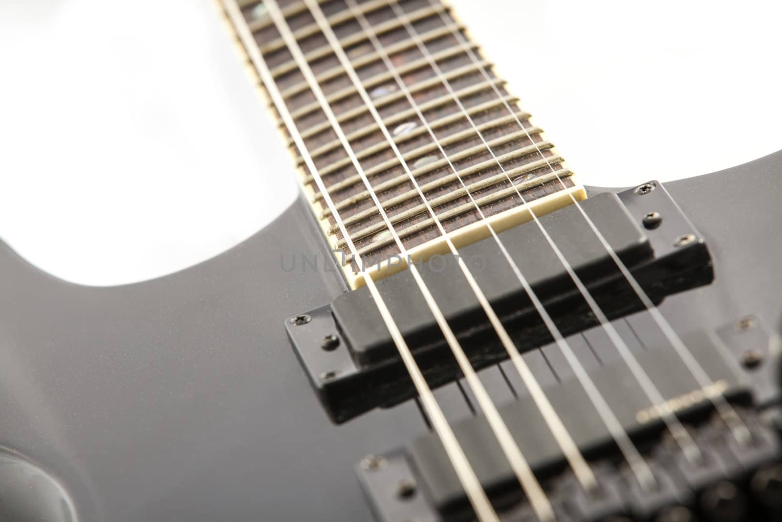 Electric guitar detail shots over white backdrop