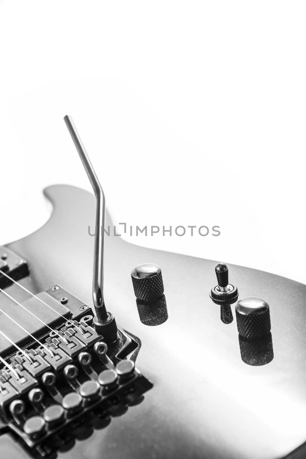 Electric guitar detail shots over white backdrop