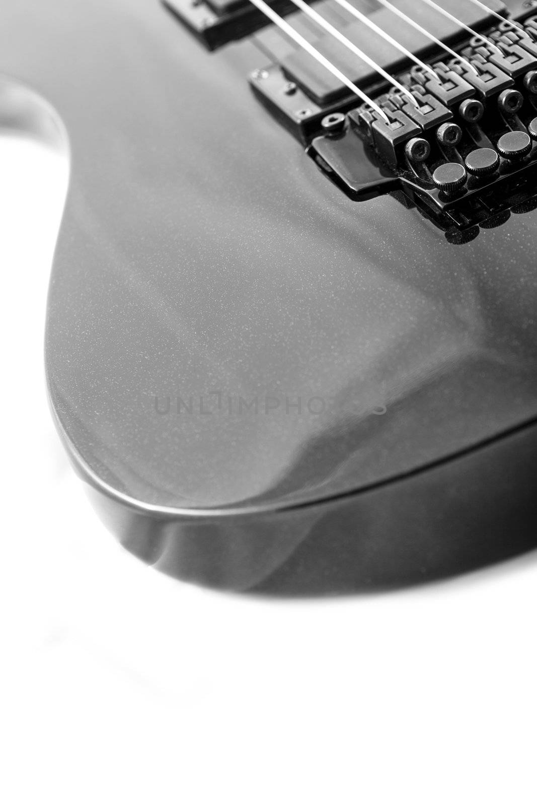 Electric guitar detail shots over white backdrop