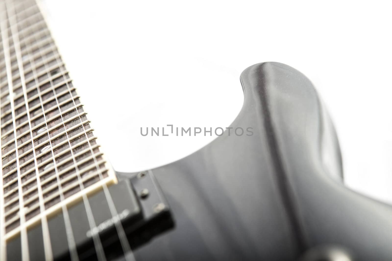 Electric guitar detail shots over white backdrop