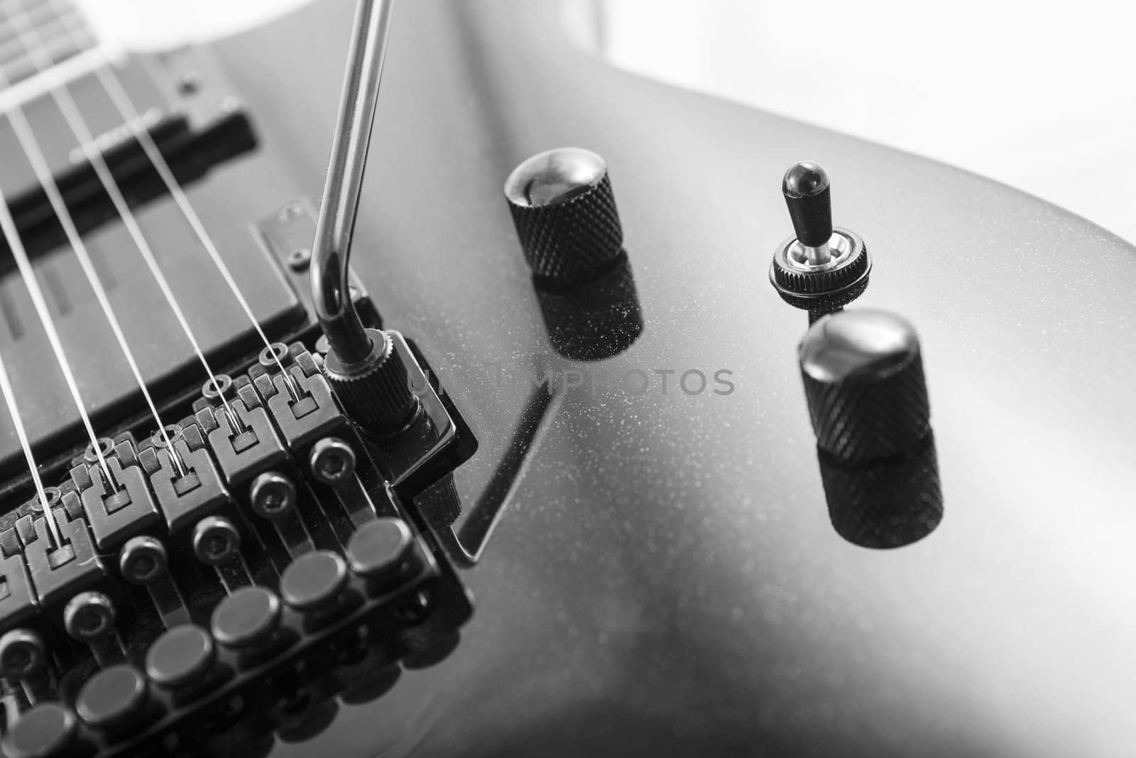 Electric guitar detail shots over white backdrop