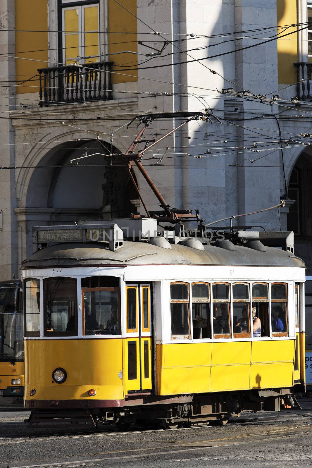 Typical yellow Tram in old street, Lisbon