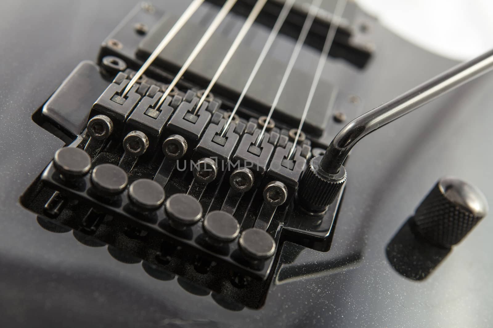 Electric guitar detail shots over white backdrop