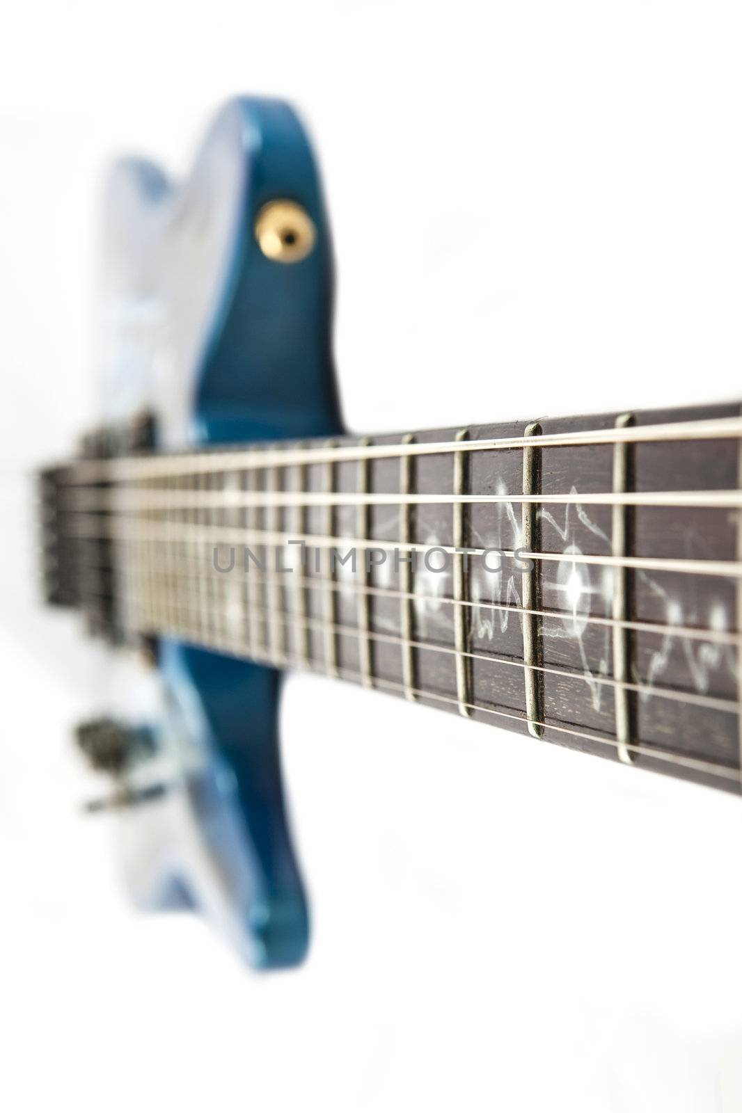 Electric guitar detail shots over white backdrop