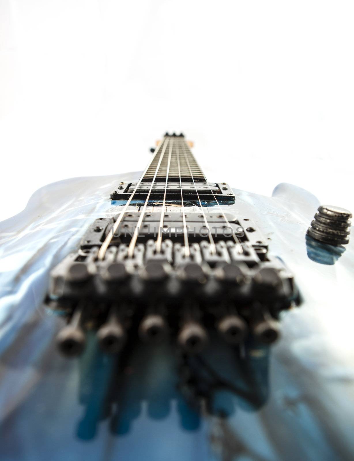 Electric guitar detail shots over white backdrop