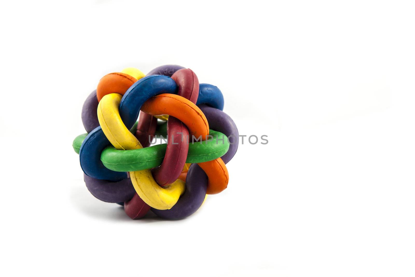 A multi coloured rubber ball dog toy