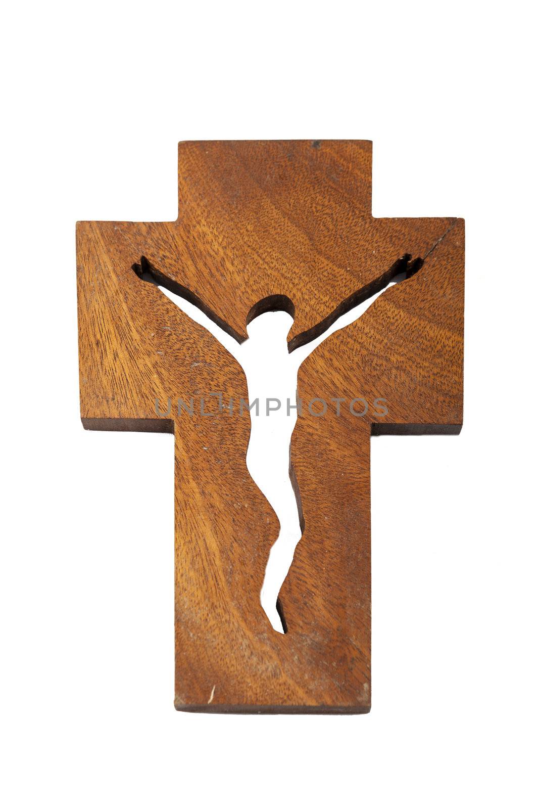 Modern wooden crucifix over a white backdrop