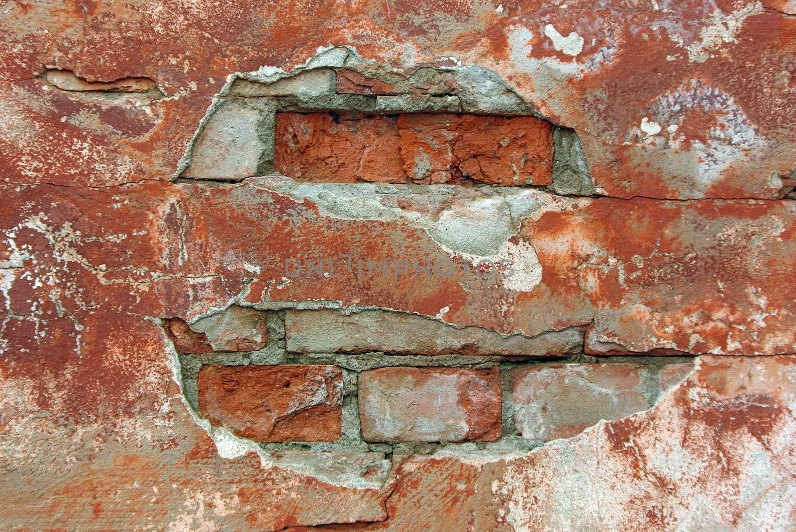 Old weathered brick wall fragment close up