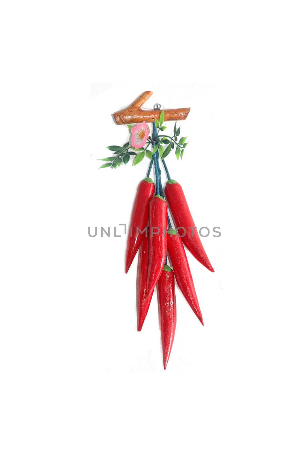 fake red chilli as wall hangings isolated on white background