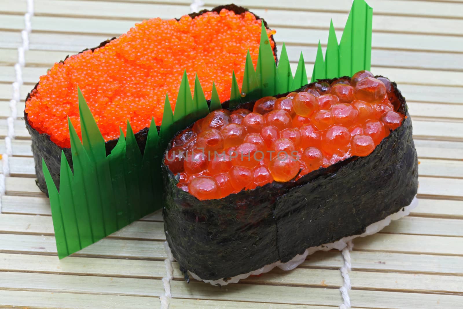 closeup of salmon egg and red caviar sushi 