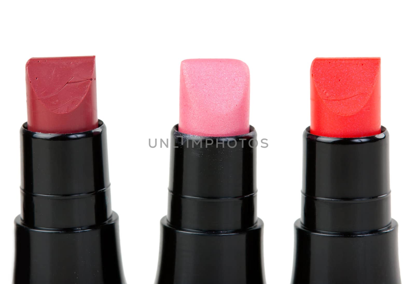 Three lipstick set in a row, isolated on white background