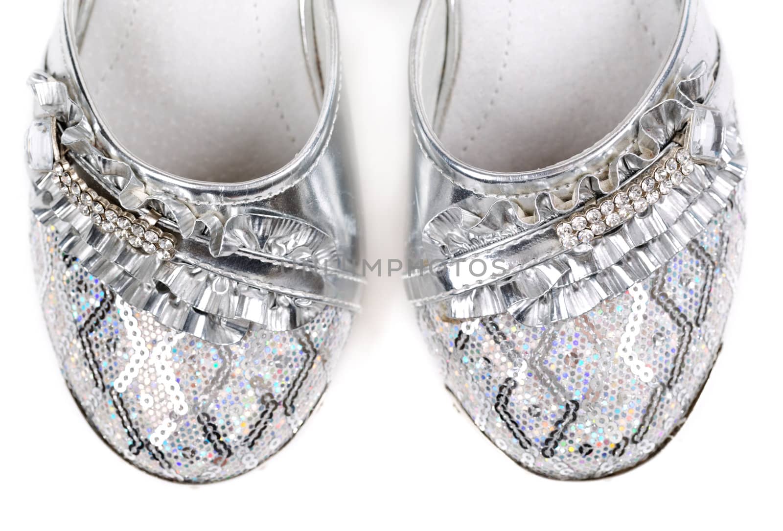 Children's fancy shoes isolated on white background. Close-up.
