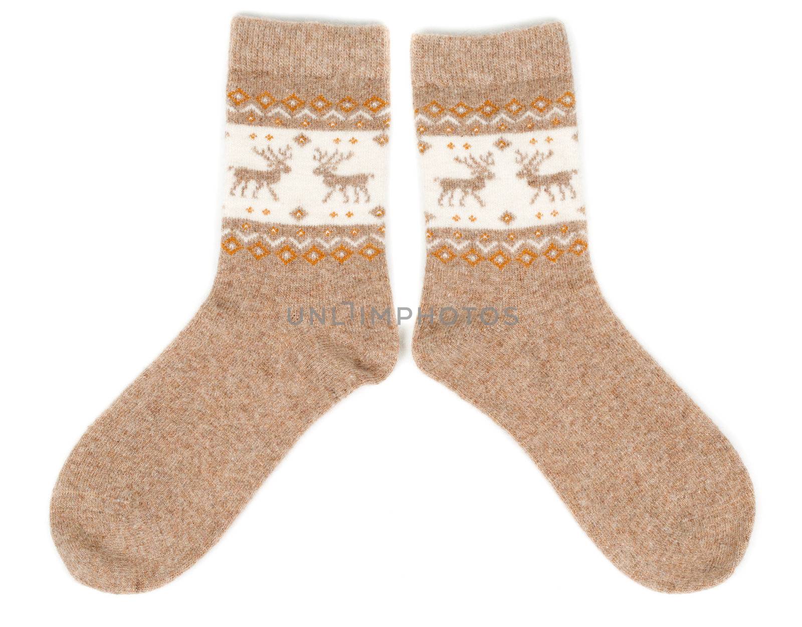 pair of wool socks with a pattern deer. Isolate on white.
