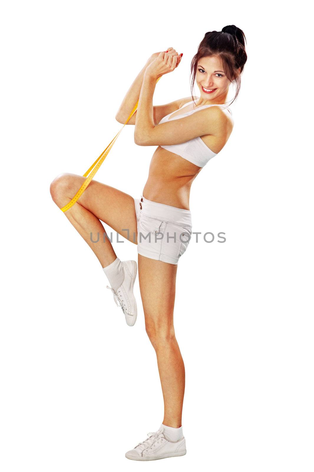 Young happy woman measures her leg on white background with path