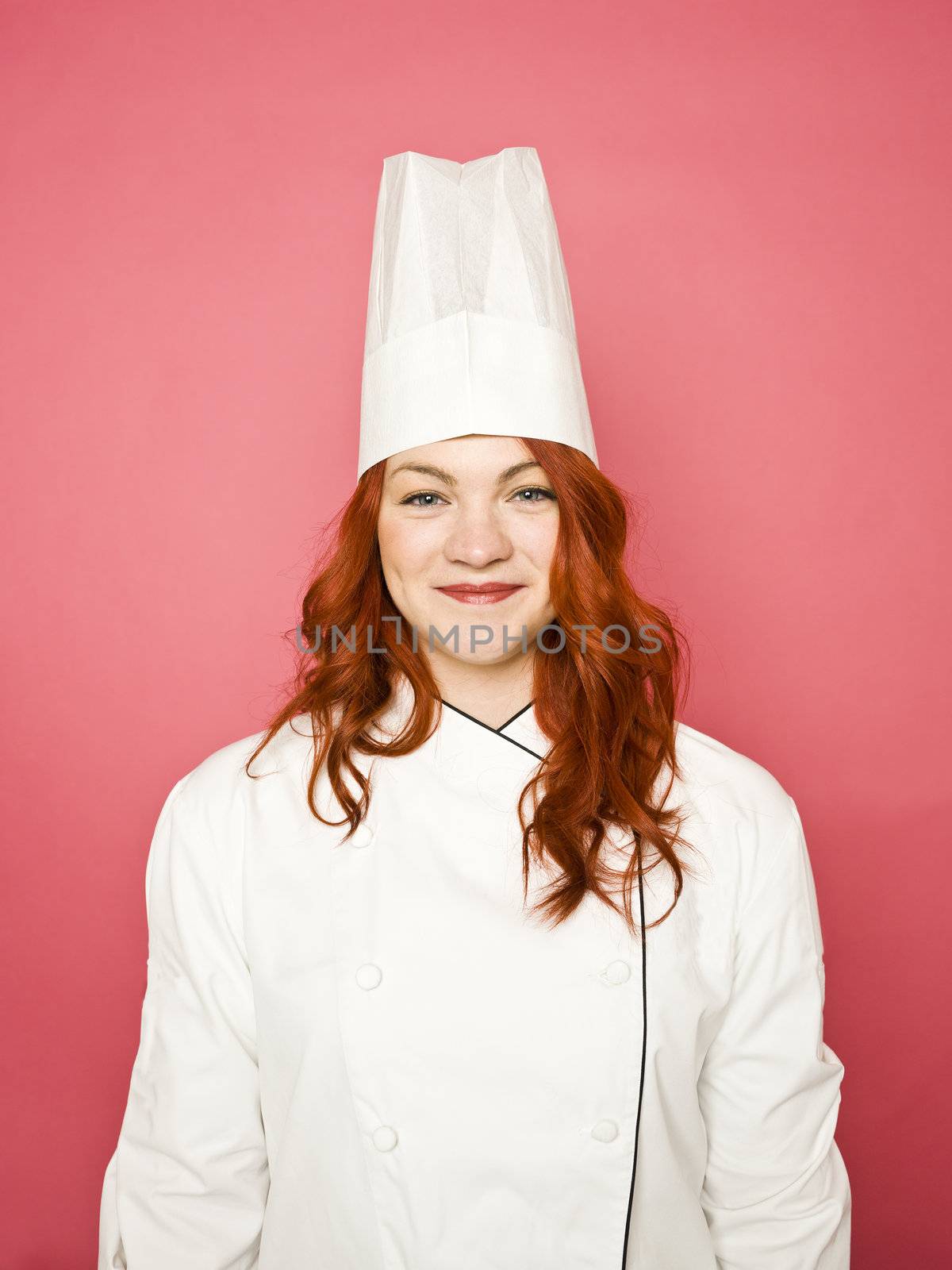 Female Chef on pink background